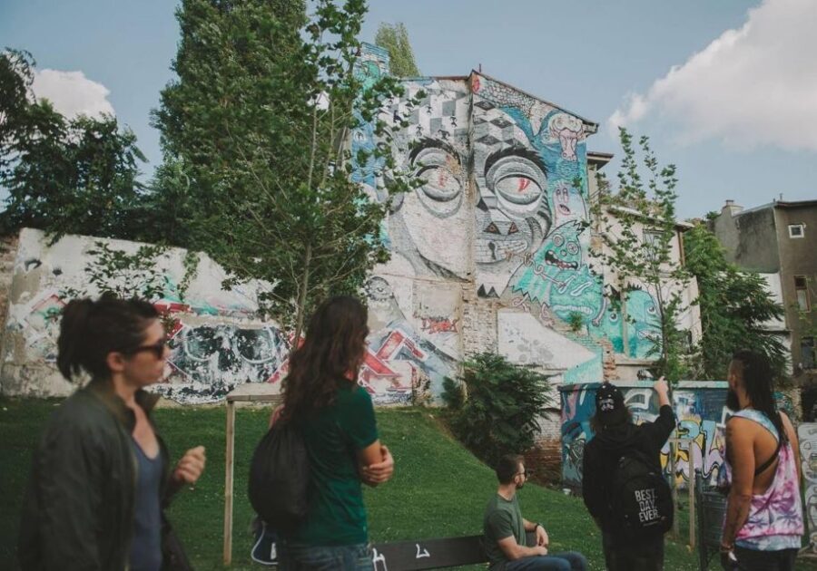 Bucharest Alternative Walking Tour - From Piata Romana to secret courtyards and first big walls