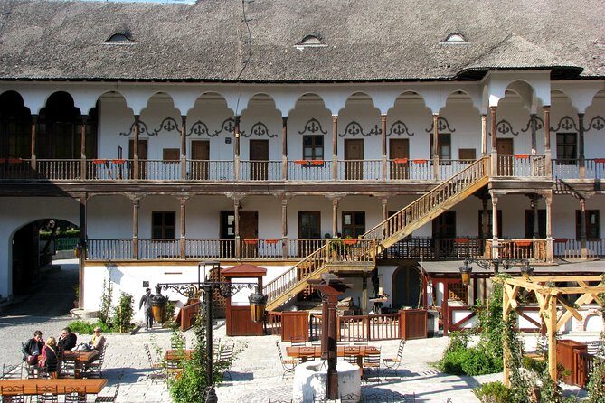 Bucharest Half a Day Bike Tour - Manuc’s Inn and the civic shift: food influences, community, and the odd romance stop