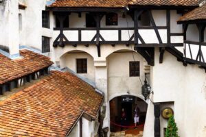 Day trip to Dracula's Castle, Peles Castle and Medieval Brasov - Bran Castle: fortress walls, Dracula legend, and real crowds