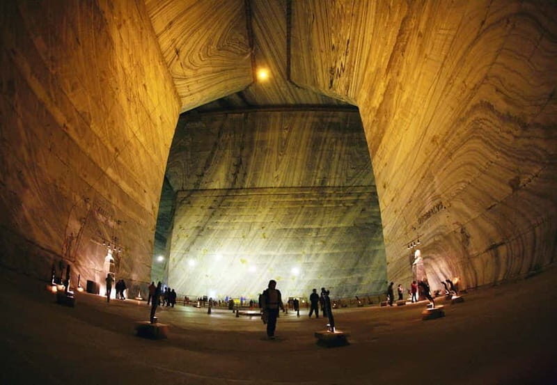From Bucharest: Slănic Prahova Salt Mine Ticket and Transfer - Inside the chambers: salt lake, waterfall, and the view from the bridge